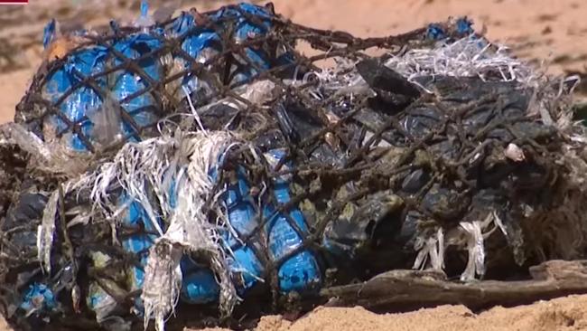 The suspicious package, believed to be drugs, washed up on Sydney's Malabar Beach, forcing the council to shut it down. Picture: 7News