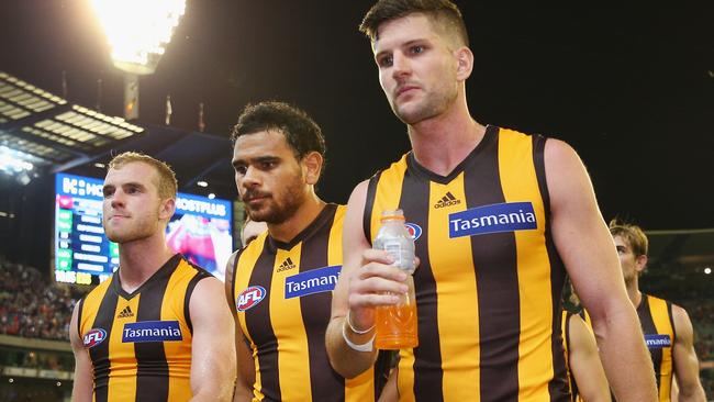 Cyril Rioli and teammates Tom Mitchell and Luke Breust leave the MCG after another loss. Picture: Getty