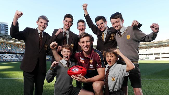 Brisbane Lions star Harris Andrews with students from Padua College at The Gabba ahead of the clash with Geelong.