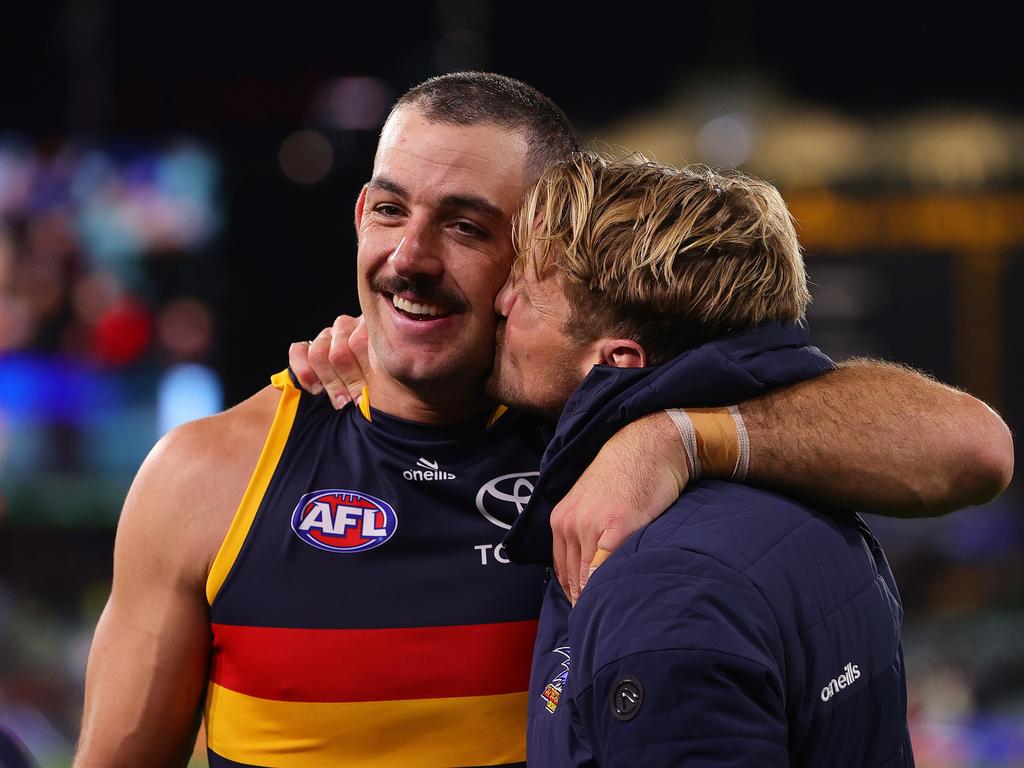 Taylor Walker and Rory Sloane after the Crows sent off their retiring star in stunning fashion. Picture: Sarah Reed/AFL Photos