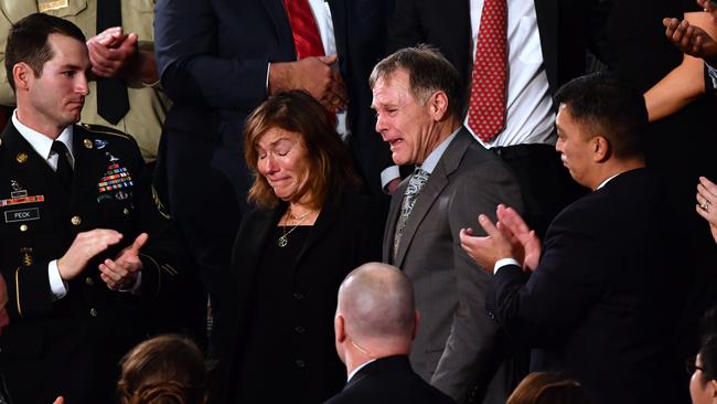 Fred and Cindy Warmbier, the parents of Otto Warmbier, are saluted by President Trump. Picture: AFP