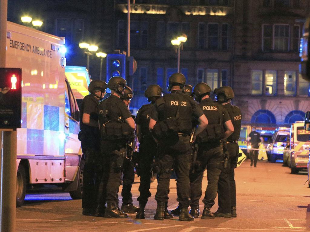 Armed police gather at Manchester Arena after reports of an explosion at the venue during an Ariana Grande concert. Picture: AP