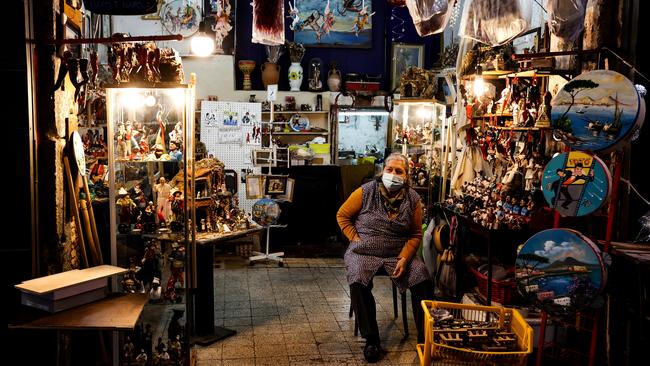 A shop owner waits for customers in San Gregorio Armeno. Picture: IPA