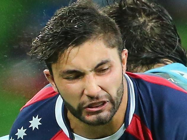 MELBOURNE, AUSTRALIA - MAY 23: Colby Fainga'a of the Rebels is tackled during the round 15 Super Rugby match between the Rebels and the Waratahs at AAMI Park on May 23, 2014 in Melbourne, Australia. (Photo by Scott Barbour/Getty Images)