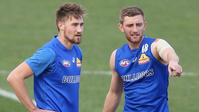 Mid-season draftee Ryan Gardner receives some advice from fellow Dogs defender Fletcher Roberts. Pic: Getty Images