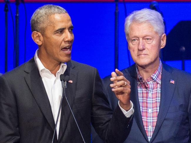 (FILES) In this file photo taken on October 21, 2017, (L-R) George W. Bush, Barack Obama and Bill Clinton attend the Hurricane Relief concert in College Station, Texas. - Obama, Bush and Bill Clinton are volunteering to take a coronavirus vaccine on camera if it will help promote public confidence. Obama, in an interview with SiriusXM radio, said he would be inoculated if top US infectious disease expert Anthony Fauci signs off on a Covid-19 vaccine. Freddy Ford, Bush's chief of staff, told CNN the former president also wanted to help promote vaccination. Angel Urena, Clinton's press secretary, told CNN the former president would also be willing to take a vaccine in public on television. (Photo by JIM CHAPIN / AFP)