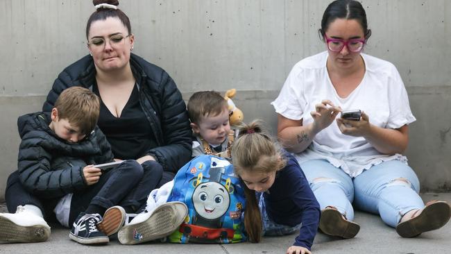 Soccer fans of all ages were forced to wait. Picture: Ian Currie