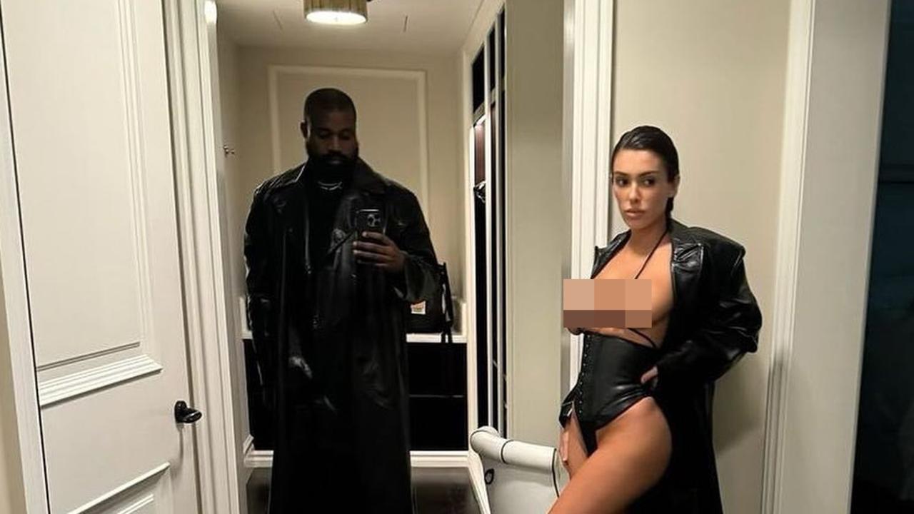 Controversial rapper Kanye West with Bianca Censori as she wore a long trench coat and calf-high heeled boots.