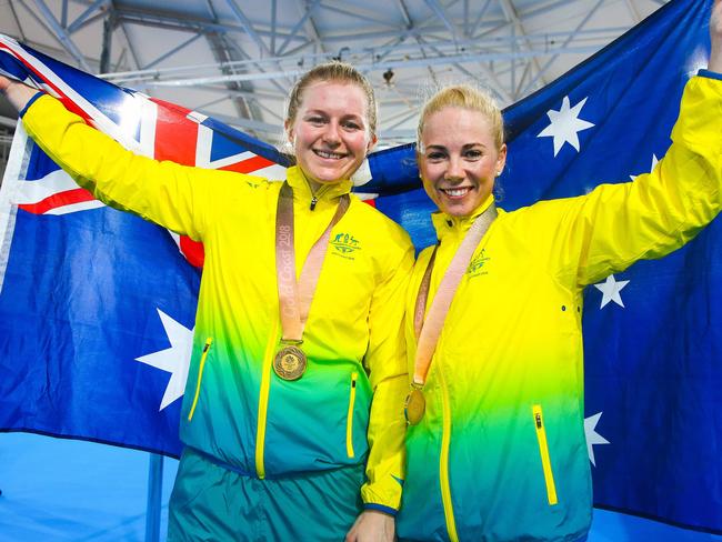 Kaarle McCulloch and Stephanie Morton celebrating their women's cycling team sprint final win. AFP PHOTO / Patrick HAMILTON