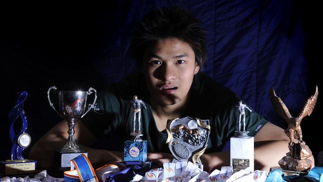 Swim star Kenneth To at home in Ashbury with some of his medals in 2009.