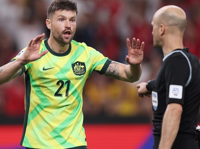 SYDNEY, AUSTRALIA - MARCH 20:  Cameron Burgess of Australia argues with the referee after a penalty was given to Indonesia during the round three FIFA 2026 World Cup AFC Asian Qualifier match between Australia Socceroos and Indonesia at Allianz Stadium on March 20, 2025 in Sydney, Australia. (Photo by Matt King/Getty Images)