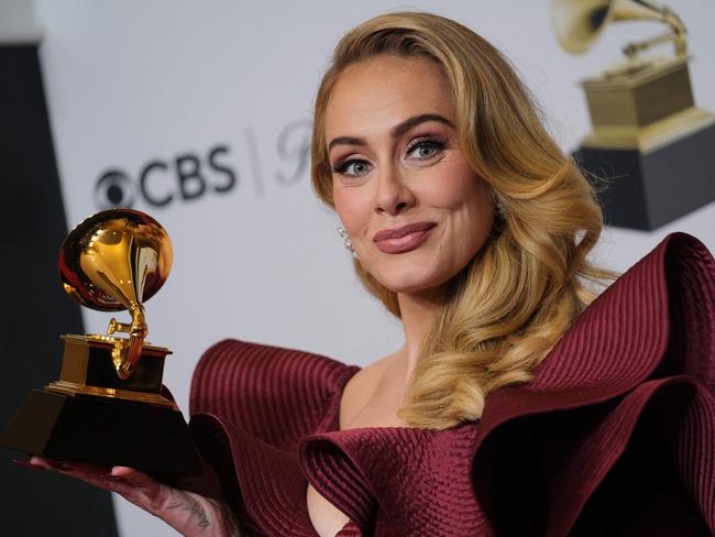 English singer-songwriter Adele poses with the award for Best Pop Solo Performance for "Easy on Me" in the press room during the 65th Annual Grammy Awards at the Crypto.com Arena in Los Angeles on February 5, 2023. (Photo by Chris Delmas / AFP)