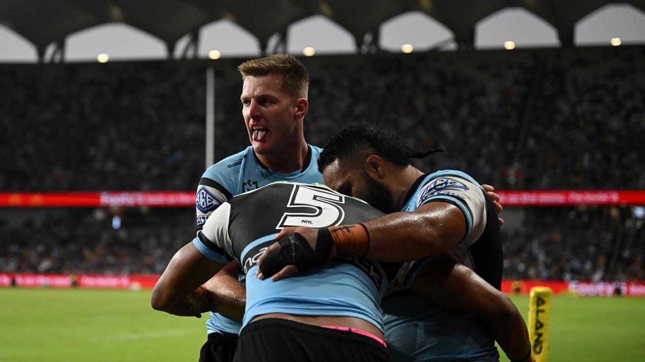 Cronulla celebrate a Ronaldo Mulitalo try in the come-from-behind victory. Picture: NRL PHOTOS