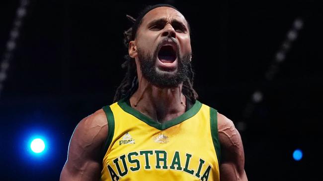 Patty Mills of Australia celebrates after making a basket in the final minutes during match 2 of the Pre-FIBA World Cup series between Australia and the USA  at Marvel Stadium in Melbourne, Saturday, August 24, 2019.  (AAP Image/Scott Barbour) NO ARCHIVING, EDITORIAL USE ONLY