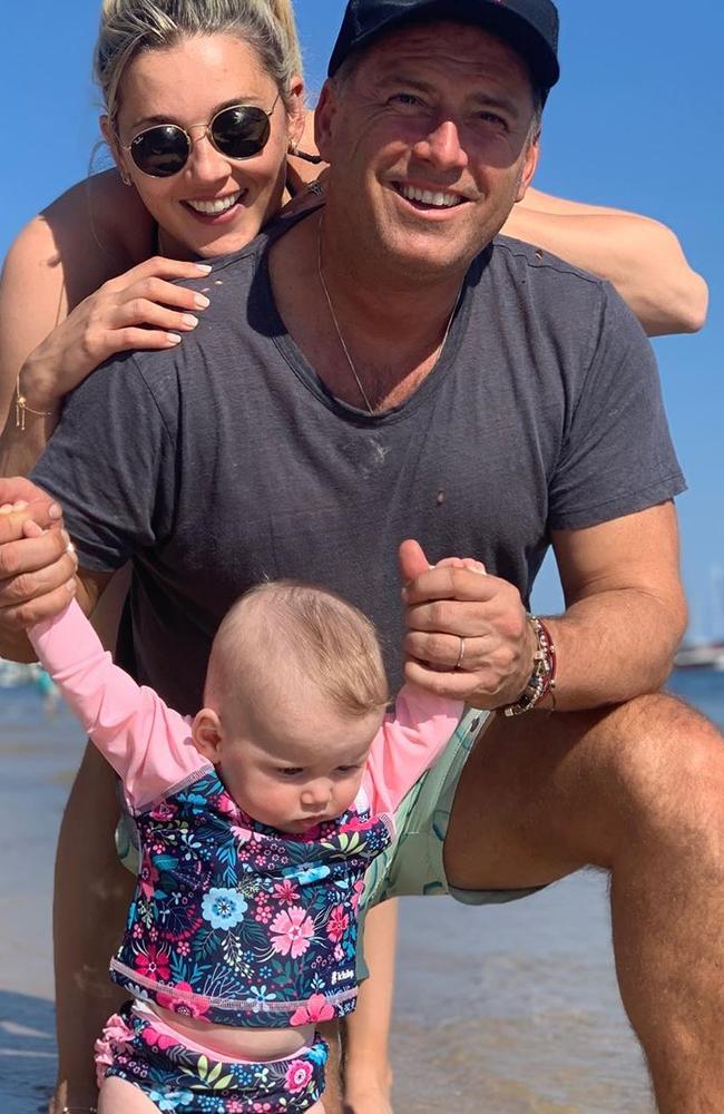 Karl Stefanovic and Jasmine Yarbrough with daughter Harper May at Palm Beach. Picture: Instagram/Supplied