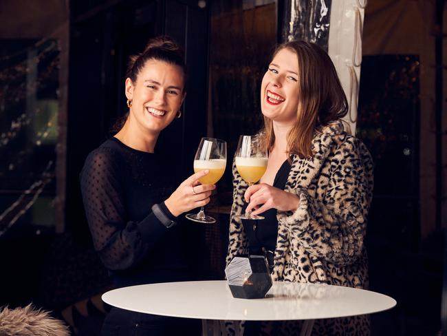 Maddie Lloyd and Vanessa Rech drinking the Nicola Spurrier cocktail at 2KW in Adelaide, Thursday, July 16, 2020. Picture: Matt Loxton