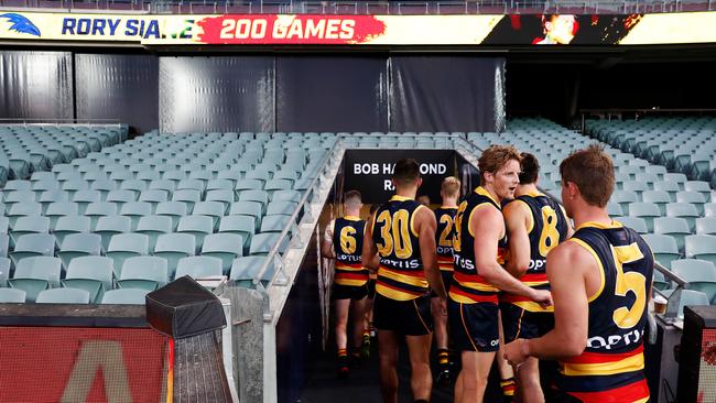 Adelaide players leave the ground following Rory Sloane’s 200th in Round 1 against Sydney, before the competition was shut down. Picture: Daniel Kalisz/Getty Images