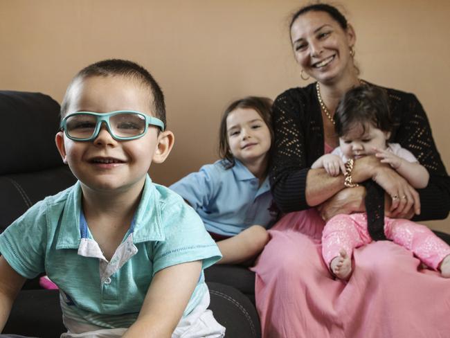 20/02/2019: (L-R) Richard ,3, Lillian, 4, Margaret Russell, Lucy-May, 6 months, at their home in Engadine in Sydney's South. He had serious but treatable eye condition and was as treated at Sydney Kids hospital but only because of after Margaret put pressure on the hospital for an appointment. If he had waited two years on the regular waiting list, doctors say he would have gone legally blind. Hollie Adams/The Australian