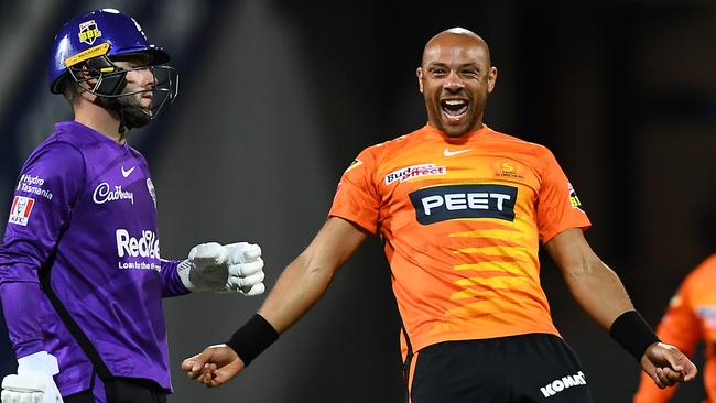 HOBART, AUSTRALIA - DECEMBER 14: Tymal Mills of the Scorchers celebrates the wicket of Caleb Jewell of the Hurricanes during the Men's Big Bash League match between the Hobart Hurricanes and the Perth Scorchers at Blundstone Arena, on December 14, 2021, in Hobart, Australia. (Photo by Steve Bell/Getty Images)