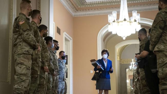 Sen. Susan Collins (R-ME) talks to National Guard troops on the third day of Donald Trump's second impeachment trial. Picture: AFP.