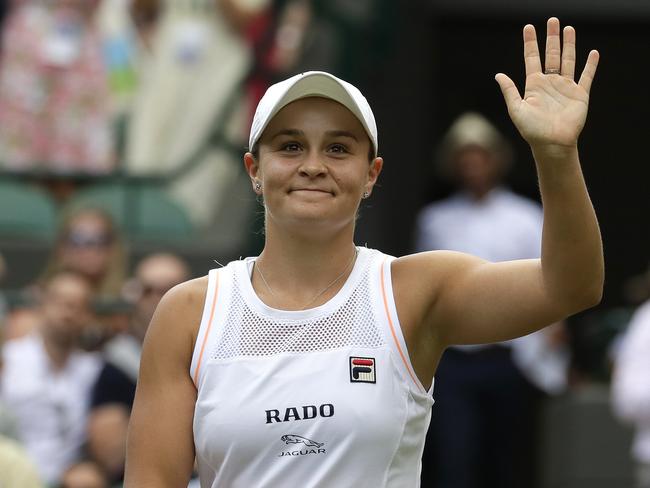 Australia's Ashleigh Barty reacts after beating China's Saisai Zheng in their Women's singles match during day two of the Wimbledon Tennis Championships in London, Tuesday, July 2, 2019. (AP Photo/Kirsty Wigglesworth)