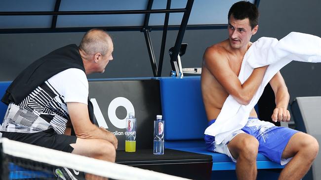 Bernard Tomic with his father, John, during a practice session in Melbourne last week. Picture: Getty