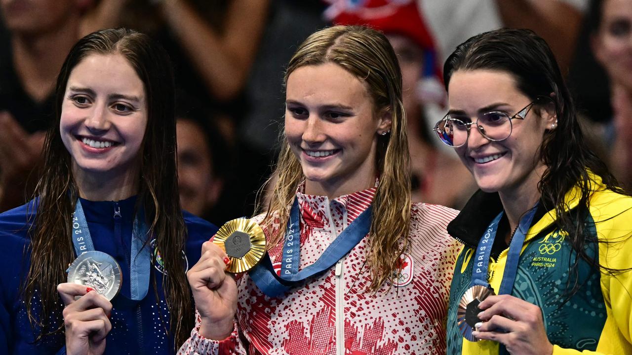 Kate Douglass, Summer Mcintosh and Kaylee McKeown on the podium. Picture: Manan Vatsyayana/AFP