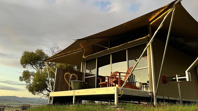 The luxury, off-grid glamping tent with an outdoor bath on the deck. Picture: Supplied.