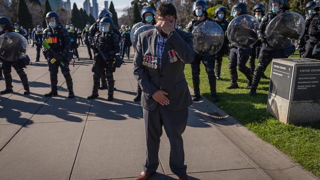 A veteran attempts to talk to protesters at the Shrine. Picture: Jason Edwards