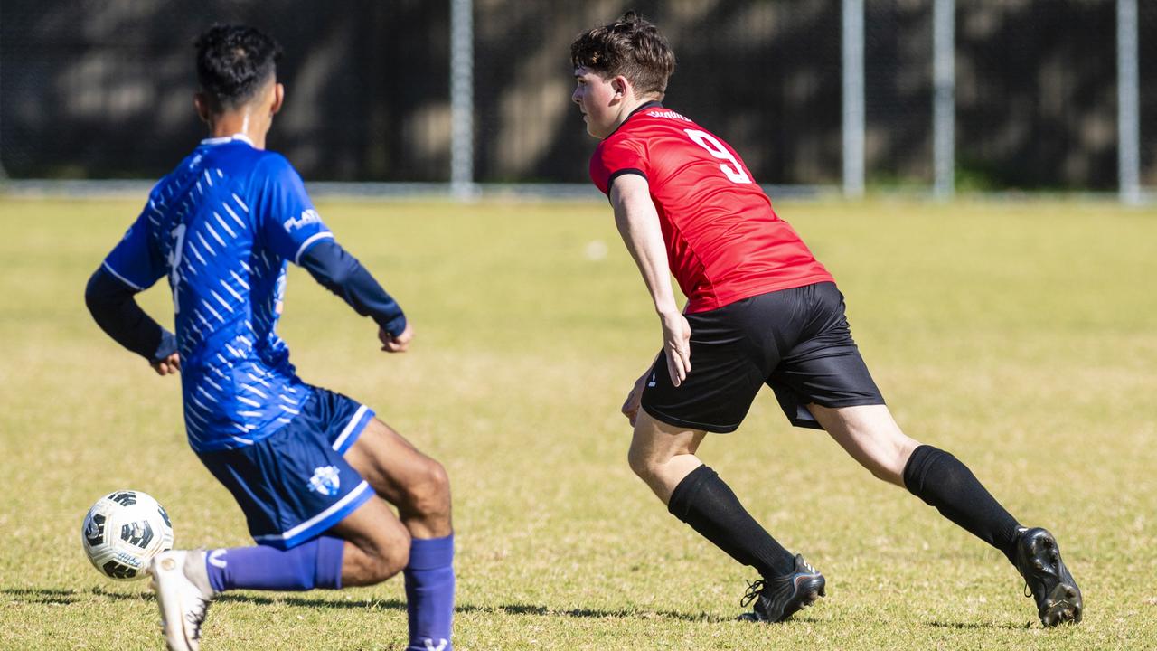 Cameron Cardillo (right) of Chinchilla Bears against Rockville Rovers in Div 1 Men FQ Darling Downs Presidents Cup football at West Wanderers, Sunday, July 24, 2022. Picture: Kevin Farmer