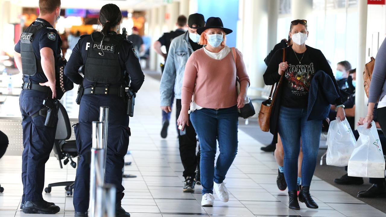 Travellers arriving at the Brisbane Airport domestic terminal to have their border passes checked. Picture: David Clark