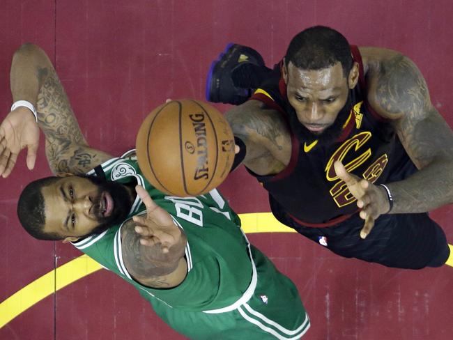 Cleveland Cavaliers' LeBron James, right, drives to the basket against Boston Celtics' Marcus Morris in the second half of Game 4 of the NBA basketball Eastern Conference finals, Monday, May 21, 2018, in Cleveland. The Cavaliers won 111-102. (AP Photo/Tony Dejak)