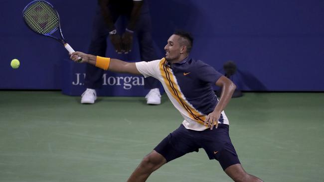 Nick Kyrgios chases a shot from Radu Albot. Picture: Julio Cortez/AP