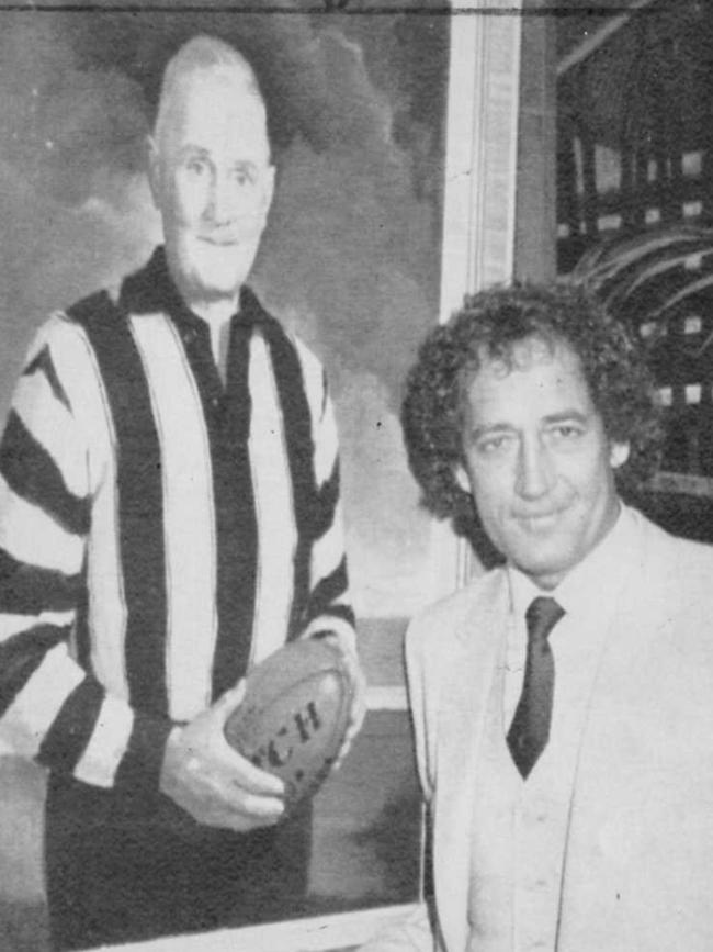 John Cahill with a portrait of Jock McHale after being appointed Collingwood coach.