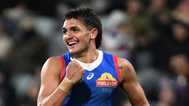 GEELONG, AUSTRALIA - JULY 20: Jamarra Ugle-Hagan of the Bulldogs celebrates kicking a goal during the round 19 AFL match between Geelong Cats and Western Bulldogs at GMHBA Stadium, on July 20, 2024, in Geelong, Australia. (Photo by Daniel Pockett/Getty Images)