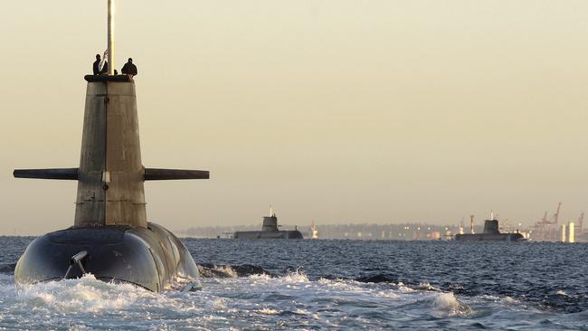 HMAS Collins (foreground) rendezvous with HMAS Waller (centre) and HMAS Rankin. Picture: Petty Officer Photographer Damian Pawlenko