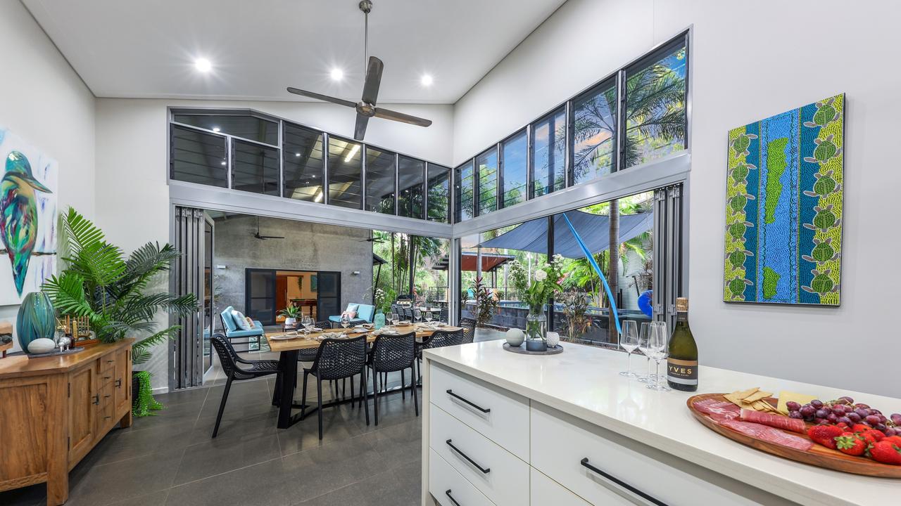 The open plan kitchen and dining area has high ceilings. Picture: Supplied