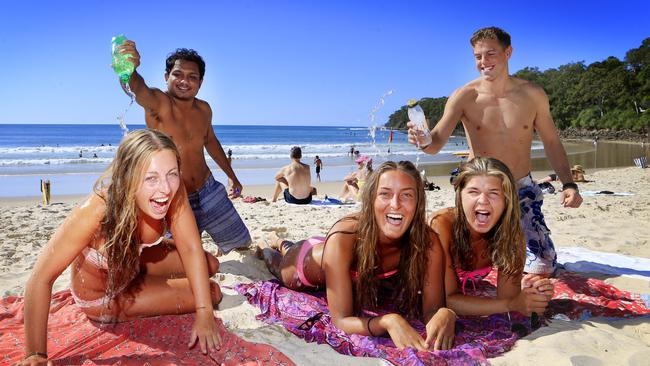 Backpackers at Noosa beach prior to the Covid-19 pandemic. Picture: Megan Slade.