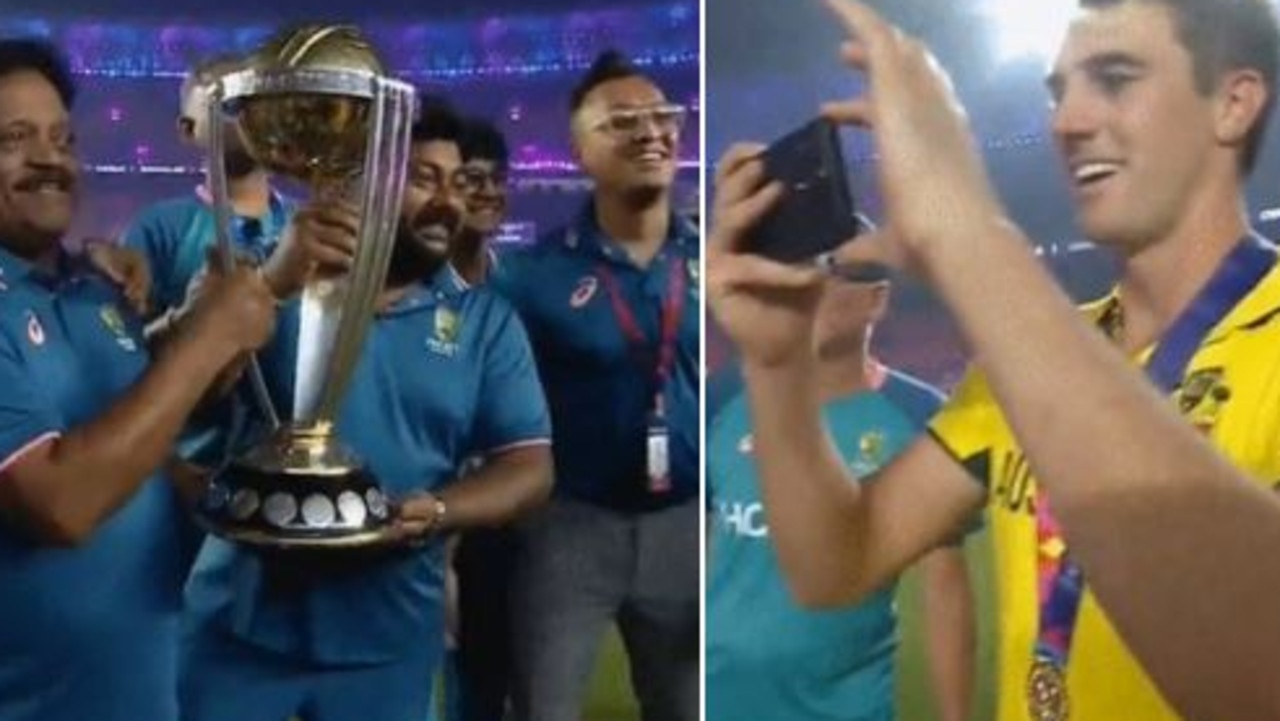 Pat Cummins gives the World Cup trophy to Indian support staff and snaps a precious moment for them. Picture: Supplied