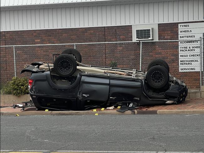 An overturned stolen ute which allegedly killed an 18-year-old in Alice Springs who was riding in the passenger window. Picture: Supplied