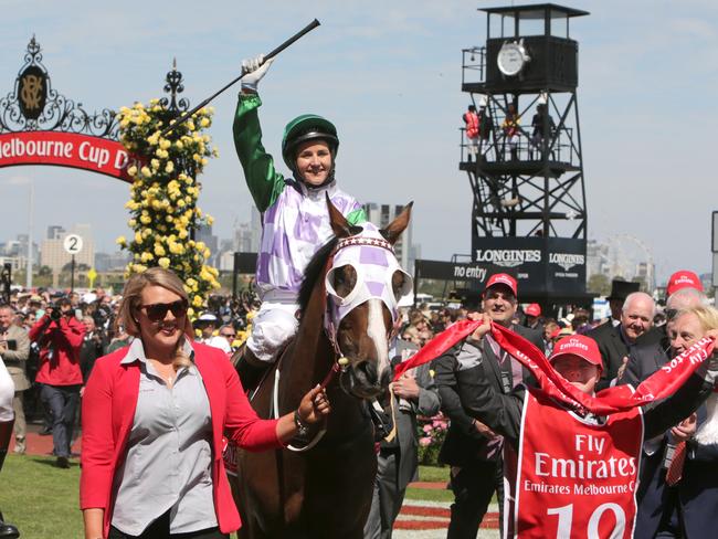 The real deal: Michelle Payne on Pride of Penzance with Stevie Payne after winning the 2015 Melbourne Cup.