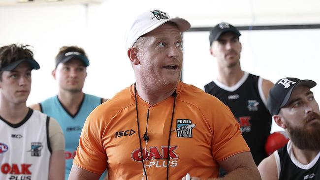 13/12/18 - AFL - Port Adelaide arrive in Noosa for the start of a 6-day training camp. On Noosa Oval. Michael Voss talking to players before the start of training. Picture SARAH REED