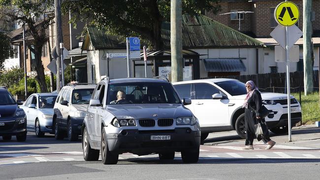 A car drives straight through the pedestrian crossing outside the service station. Picture: John Appleyard