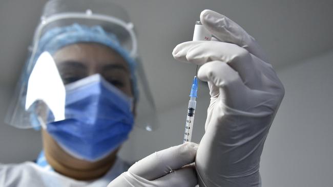 A health worker takes part in a vaccination drill. Picture:/Getty Images.