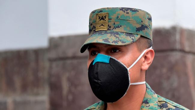 A military man stands guard at the government palace in Quito, on March 19, 2020. Picture: RODRIGO BUENDIA.