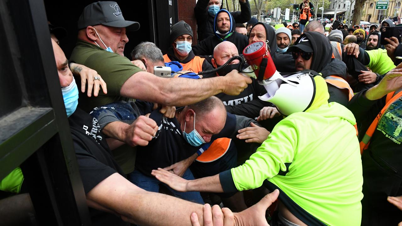 Construction workers clash with unionists at a protest at CFMEU headquarters in Melbourne. Picture: James Ross/AAP