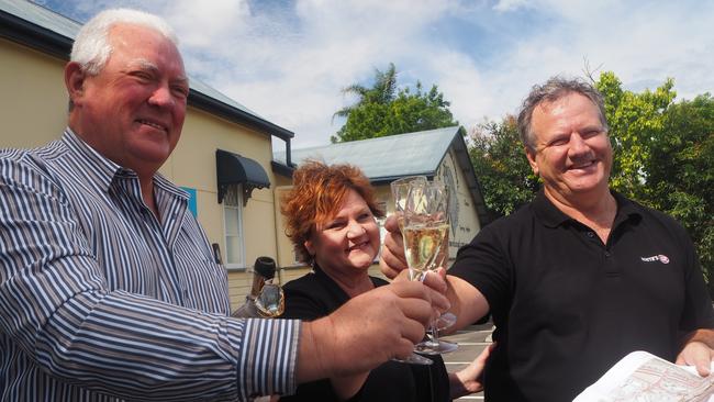 Sancus Property principal Tony Riddle and Whites IGA owners Roz and Michael White celebrate the approval of the Forest Glen Village Centre development. Picture: Tegan Annett