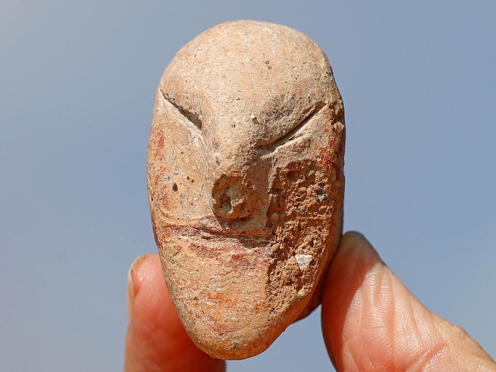 A picture taken on October 06, 2019 shows a figurine of a human face unearthed at the archaeological site. Picture: Jack Guez/AFP