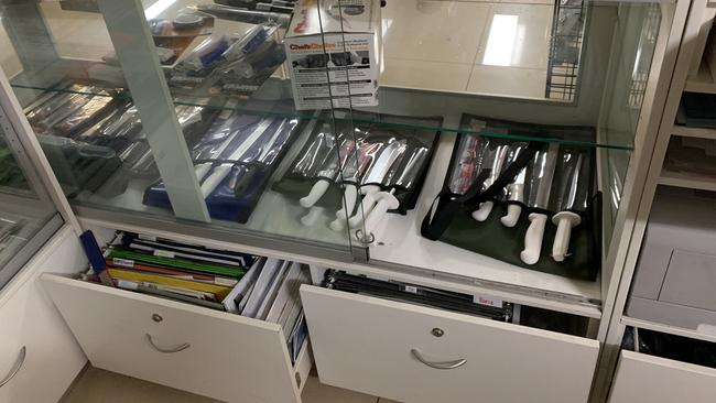 Empty store shelves show where thieves stole about 50 hunting knives and machetes at Camping World. Picture: Supplied