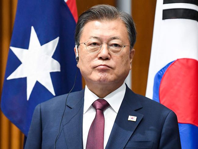 South Korean President Moon Jae-in and Australian Prime Minister Scott Morrison (not pictured) witness a signing ceremony at Parliament House in Canberra on December 13, 2021. (Photo by LUKAS COCH / POOL / AFP)